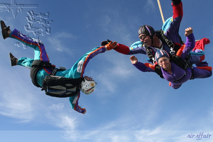 Tandem instructor Paul Stockwell with a lady passenger and AFF instructor Chris Lynch.