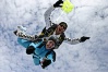 Instructor Mike Milton with passenger Debbie Hole in a classic freefall position.