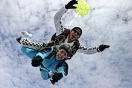 Instructor Mike Milton with passenger Debbie Hole in a classic freefall position.