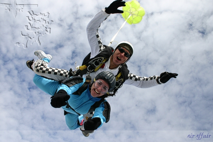 Instructor Mike Milton with passenger Debbie Hole in a classic freefall position.