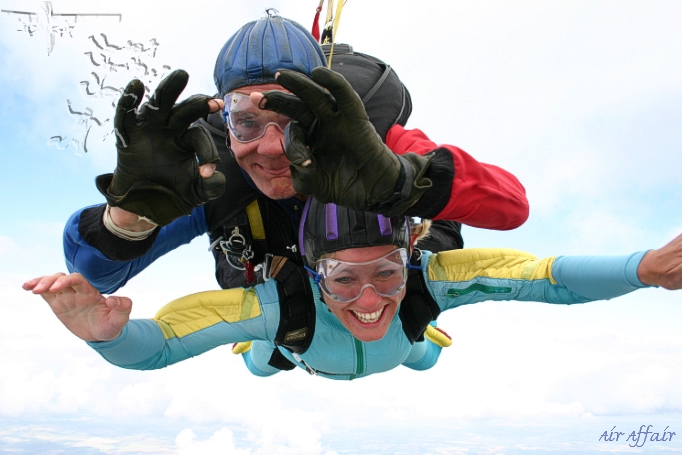 Tandem instructor Clem in freefall with Annette - we're having a ball!