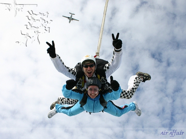 Instructor Mike Milton and passenger Debbie Hole with the Turbolet aircraft in the background.