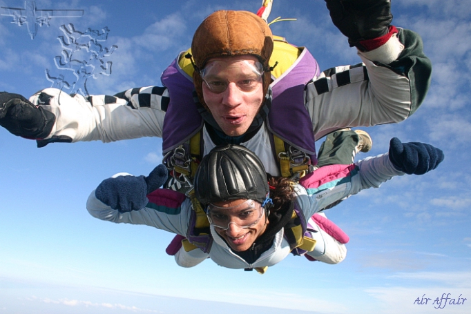 Mike jumping over Kent with tandem passenger Rachel Rodriguez.