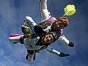 Tandem master Mike in freefall with tandem passenger Rachel Rodriguez.