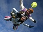 Tandem master Mike in freefall with tandem passenger Rachel Rodriguez.