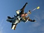 As the tandem instructor releases the drogue parachute, it activates the main canopy and starts deployment.